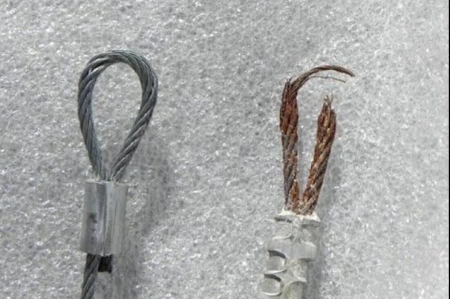 DPS Garage Doors comparison of a new garage door lifting cable beside a frayed snapped cable being replaced in the GTA