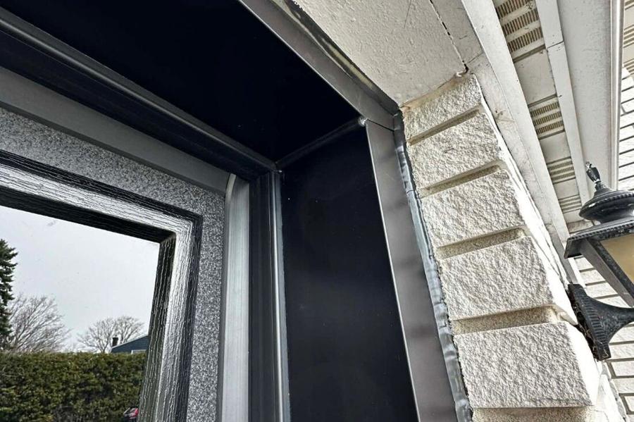 DPS Garage Doors custom-bent dark aluminum capping wrapping a garage door frame in the GTA