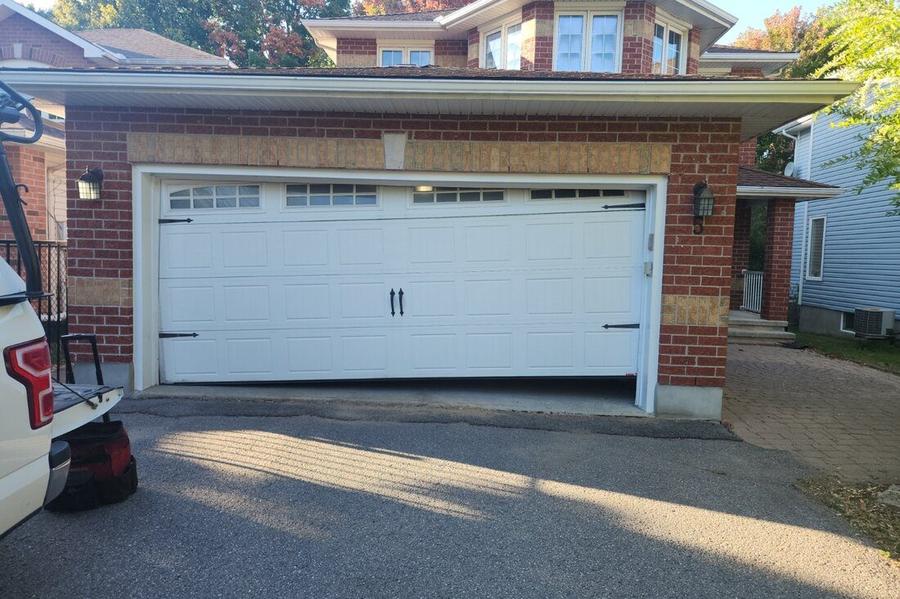 DPS Garage Doors emergency repair of an off-track jammed double garage door in the GTA