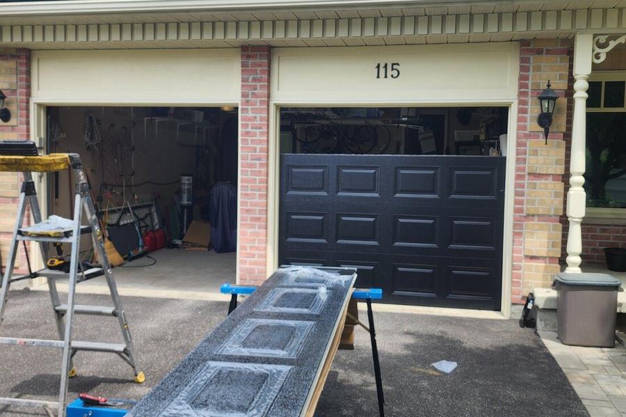 DPS Garage Doors installing a new dark insulated steel garage door in the GTA